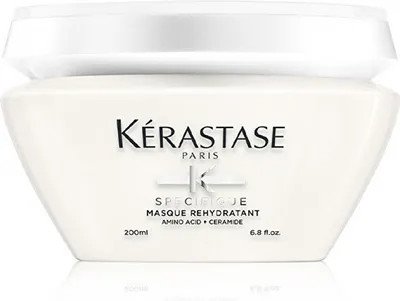 A white jar of Kérastase hair mask is shown against a white background.