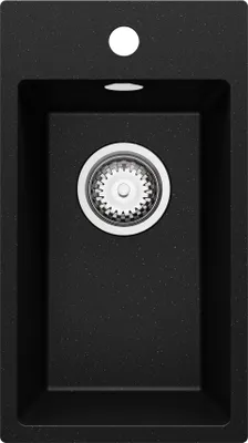 A top-down view of a black granite kitchen sink with a silver drain.