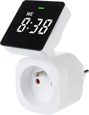 A digital timer plugged into an electrical outlet.