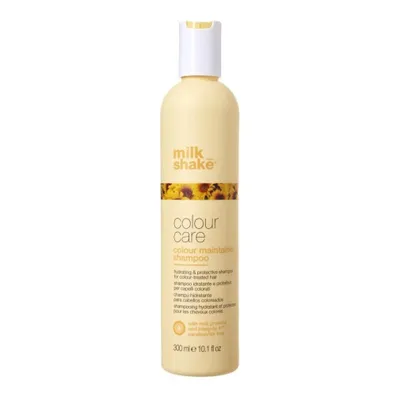 A product shot of a shampoo bottle against a white background.