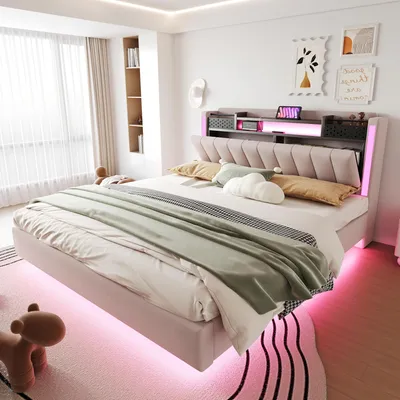 A modern bedroom with a pink upholstered bed, featuring LED lighting and storage.