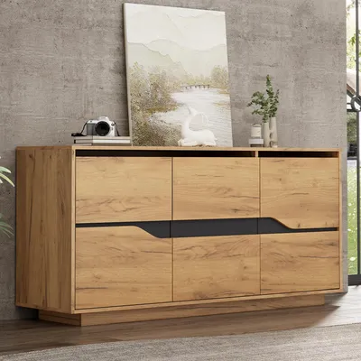 A wooden sideboard with black accents is displayed in a room with a concrete wall and a window.