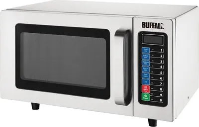 A professional studio shot of a silver microwave oven.