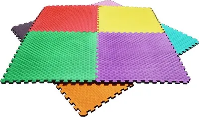 A collection of interlocking foam puzzle mats in various colors.