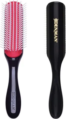 A product shot of a Denman styling brush, shown from two angles.
