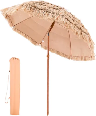 A tan beach umbrella with raffia fringe and a wooden pole, shown with its carrying case.