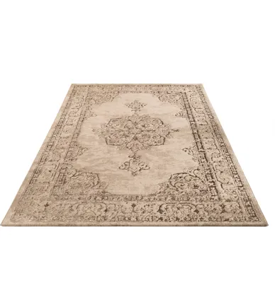 A beige oriental-style rug with an abstract pattern, shown from a slightly elevated angle on a white background.
