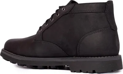 A side view of a black chukka boot.