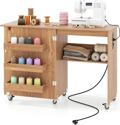 A sewing table with a sewing machine and various sewing supplies.
