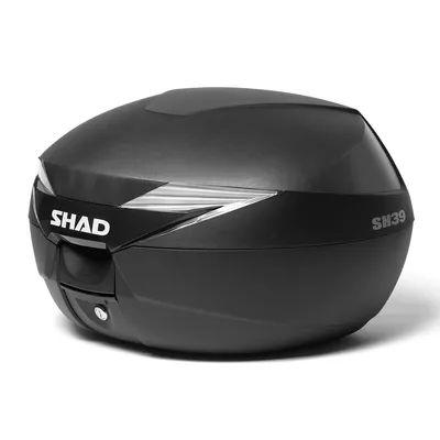 A black motorcycle top case with the brand name 'SHAD' and model 'SH39' visible.