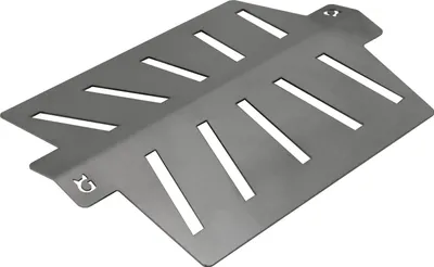 A metal heat reflector for a grill.
