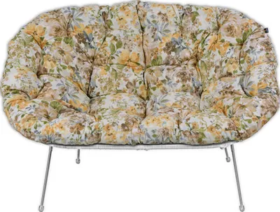 A floral patterned cushion on a metal frame.
