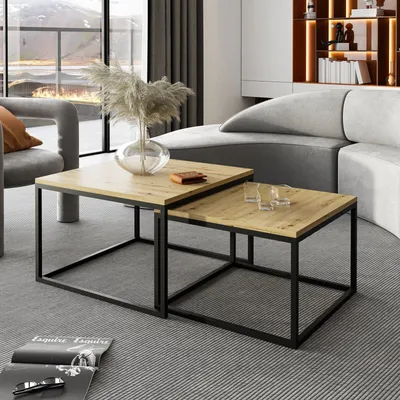 A living room scene with a sectional sofa, coffee tables, and a large window.