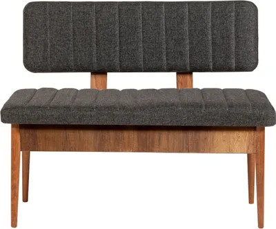 A studio shot of a bench with a dark gray upholstered seat and backrest, supported by a wooden frame.