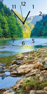 Produktbild von Wallario Design Wanduhr bedruckt, Größe 30 x 60 cm, Motiv: Fluss in den Bergen an steinigem Ufer