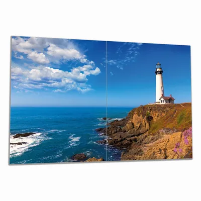 Produktbild von Wallario Herdabdeckplatte aus Glas, Größe 80 x 52 cm 2-teilig, Motiv Leuchtturm auf einem Felsvorsprung - Blauer Himmel