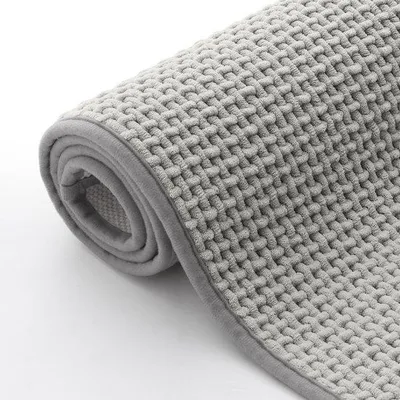 Immagine prodotto di Tappetino da bagno Unyqoos® in microfibra, 50x80 cm, grigio chiaro – morbido e assorbente, con base antiscivolo in TPR, lavabile in lavatrice