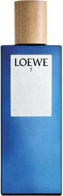 A product shot of a blue perfume bottle with a wooden cap.