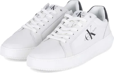 A pair of white Calvin Klein sneakers is shown from a slightly elevated angle against a white background.