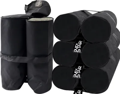 A set of black sandbags for a pavilion, stacked together.