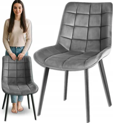 A woman stands next to a chair, with a close-up of the chair in the foreground.