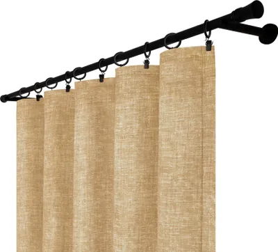 A close-up view of beige curtains hanging from a black curtain rod.