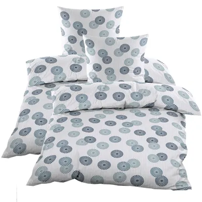 A neatly folded set of bedding with a circular pattern.