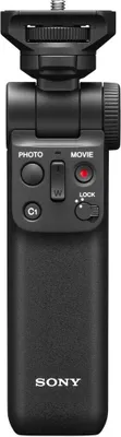 A black Sony vlogging grip with various buttons and a tripod mount.