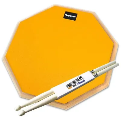 Produktbild von keepdrum Übungspad Orange 12 Zoll mit Schlagzeugstöcken