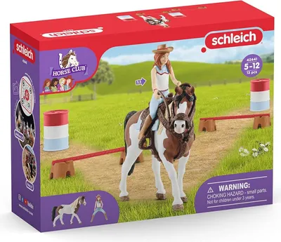 A Schleich Horse Club playset box featuring a girl riding a horse, with accessories and branding.