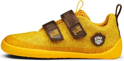 A single yellow children's shoe shown from the side against a white background.
