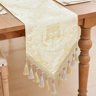 Immagine prodotto di Runner da tavolo con frange, 33x228 cm, color oro chiaro