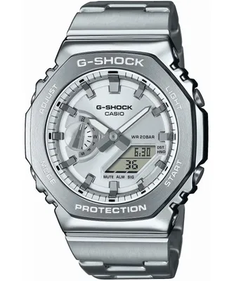 A close-up, front-facing studio shot of a silver G-Shock watch with a white face.