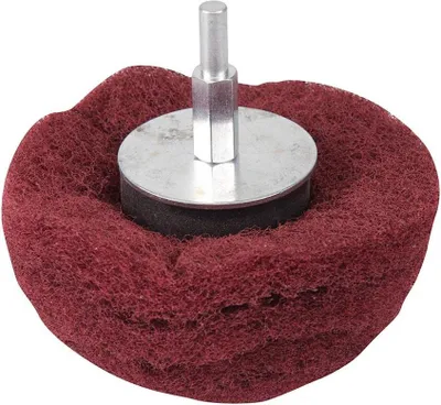 A close-up studio shot of a red abrasive buffing wheel with a silver metal shank.