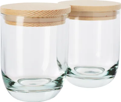 Two glass jars with wooden lids are displayed against a white background.