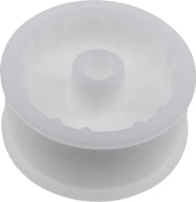 A white plastic pulley wheel with a central hub.