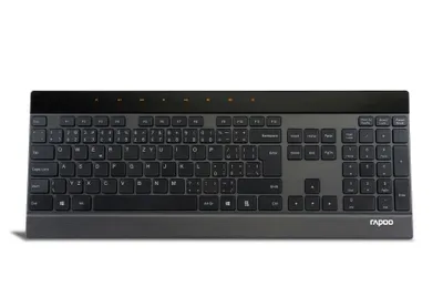 A black and gray wireless keyboard is shown against a white background.