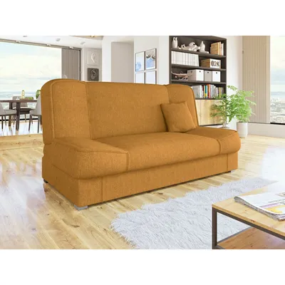 A sofa is shown in a living room setting with a bookshelf and a window in the background.