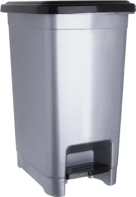 A silver trash can with a black lid and pedal.