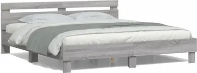 A modern bed frame with a headboard and bedding, presented against a white background.