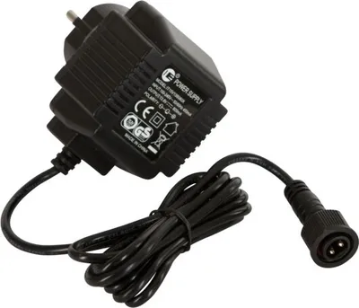 A black power adapter with a coiled cord and a connector.