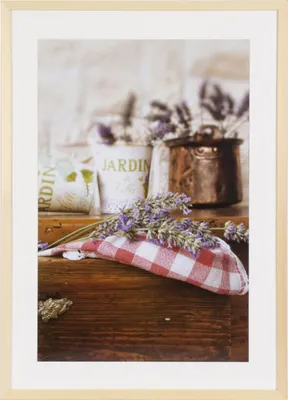 A still life arrangement featuring lavender sprigs on a red and white checkered cloth, with decorative pots and a copper pot in the background.