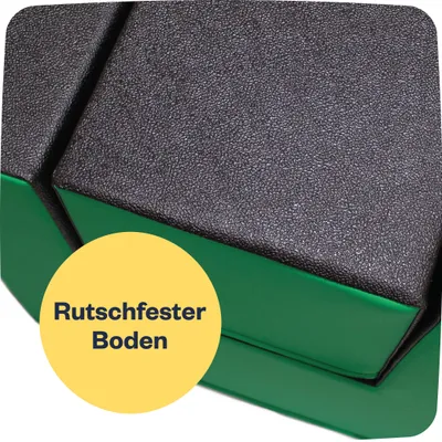 A close-up view of a section of soft play blocks, highlighting the textured black surface and green base.