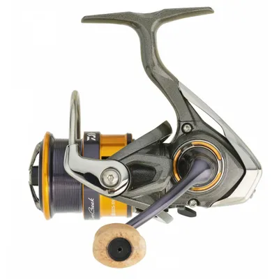 A studio shot of a fishing reel on a white background.