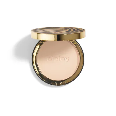 A compact powder with a zebra-patterned lid is shown against a white background.