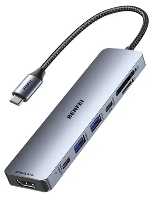 A gray USB-C hub with multiple ports and a braided cable is shown against a white background.