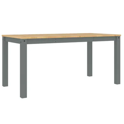 A plain studio shot of a dining table.