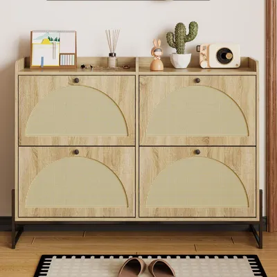 A shoe cabinet with four flip-down doors, decorated with small items on top, placed in a hallway or entryway.