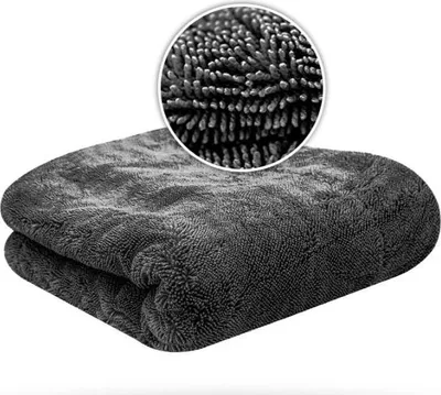 A folded gray microfiber towel with a close-up inset showing the texture of the fibers.