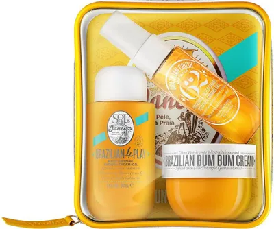 A gift set of Sol de Janeiro body care products in a clear plastic pouch.